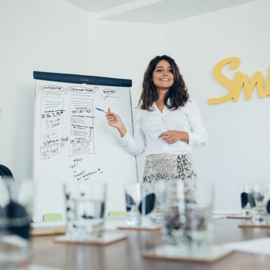 young-businesswoman-giving-presentation